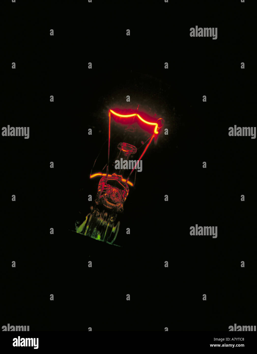 Filament of incandescent light bulb filament only glowing in the dark