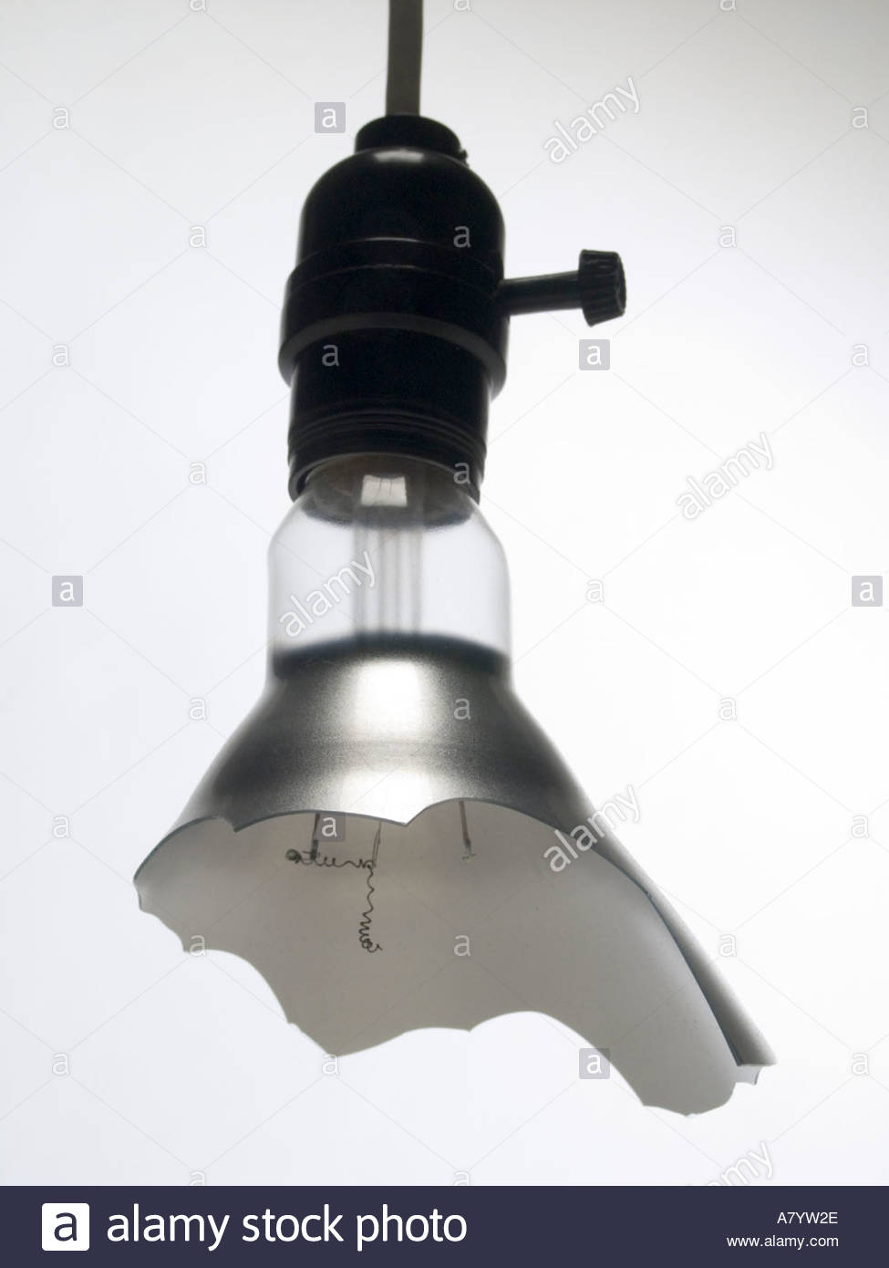 Hanging Broken Light Bulb In Socket With A Broken Wire Stock Photo