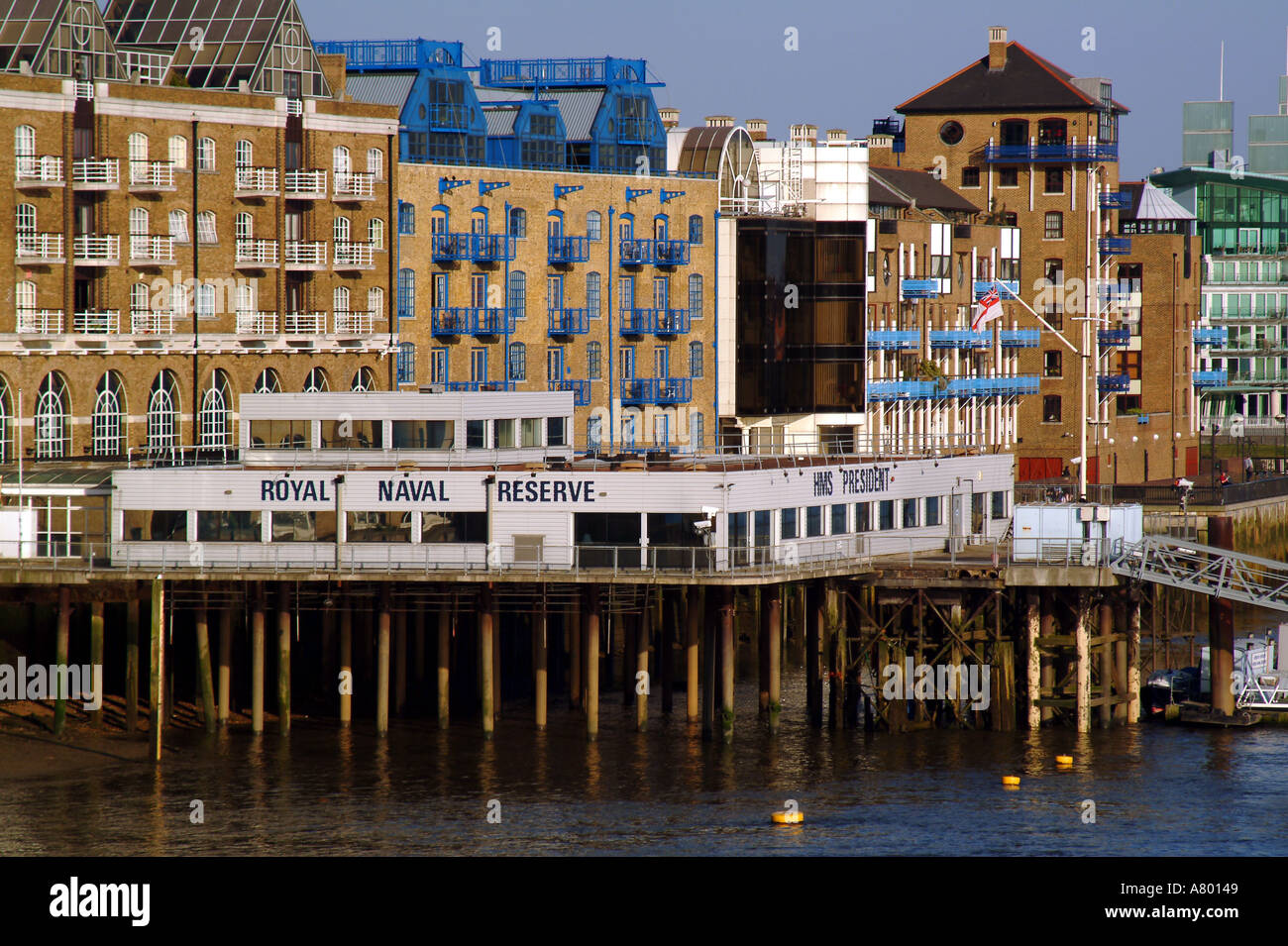 docklands old wharf buildings converted into riverside flats Stock
