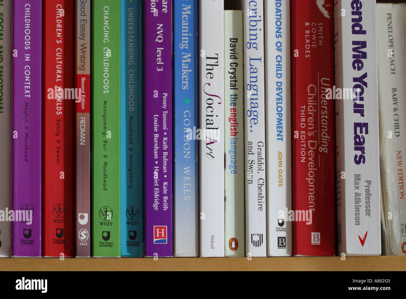 University study course text books on students bookshelf Stock Photo