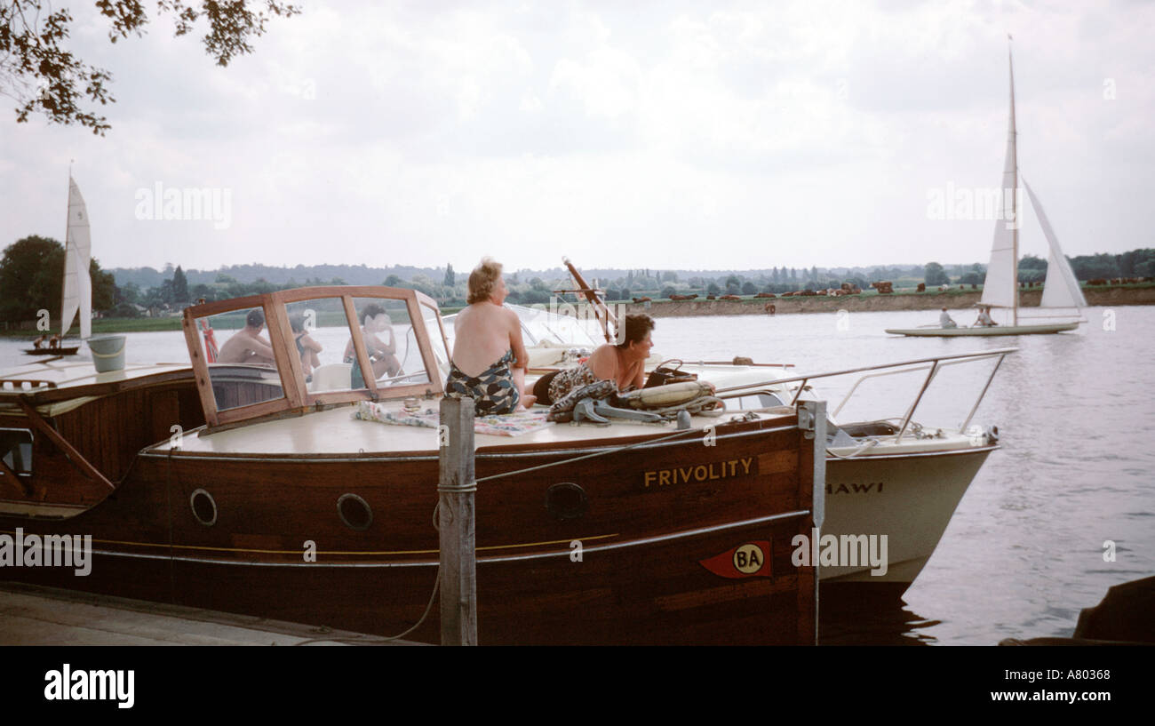 Spectators at a sailing boat race on the River Thames at Bourne End in
