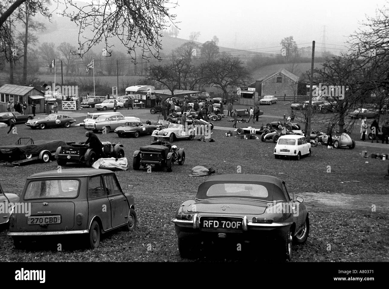 Prescott hill climb meeting 1971 with a mini and jaguar e type black and white Stock Photo