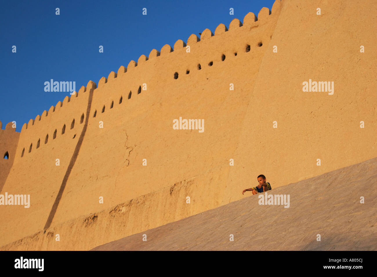 Uzbekistan, Boy On City Walls, Khiva Stock Photo