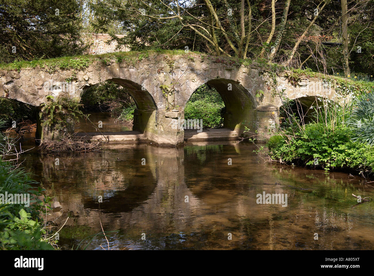 Old pack horse bridge in the ruins of Walsingham Abbey and old Priory grounds, Little Walsingham, North Norfolk, England 2007. Stock Photo