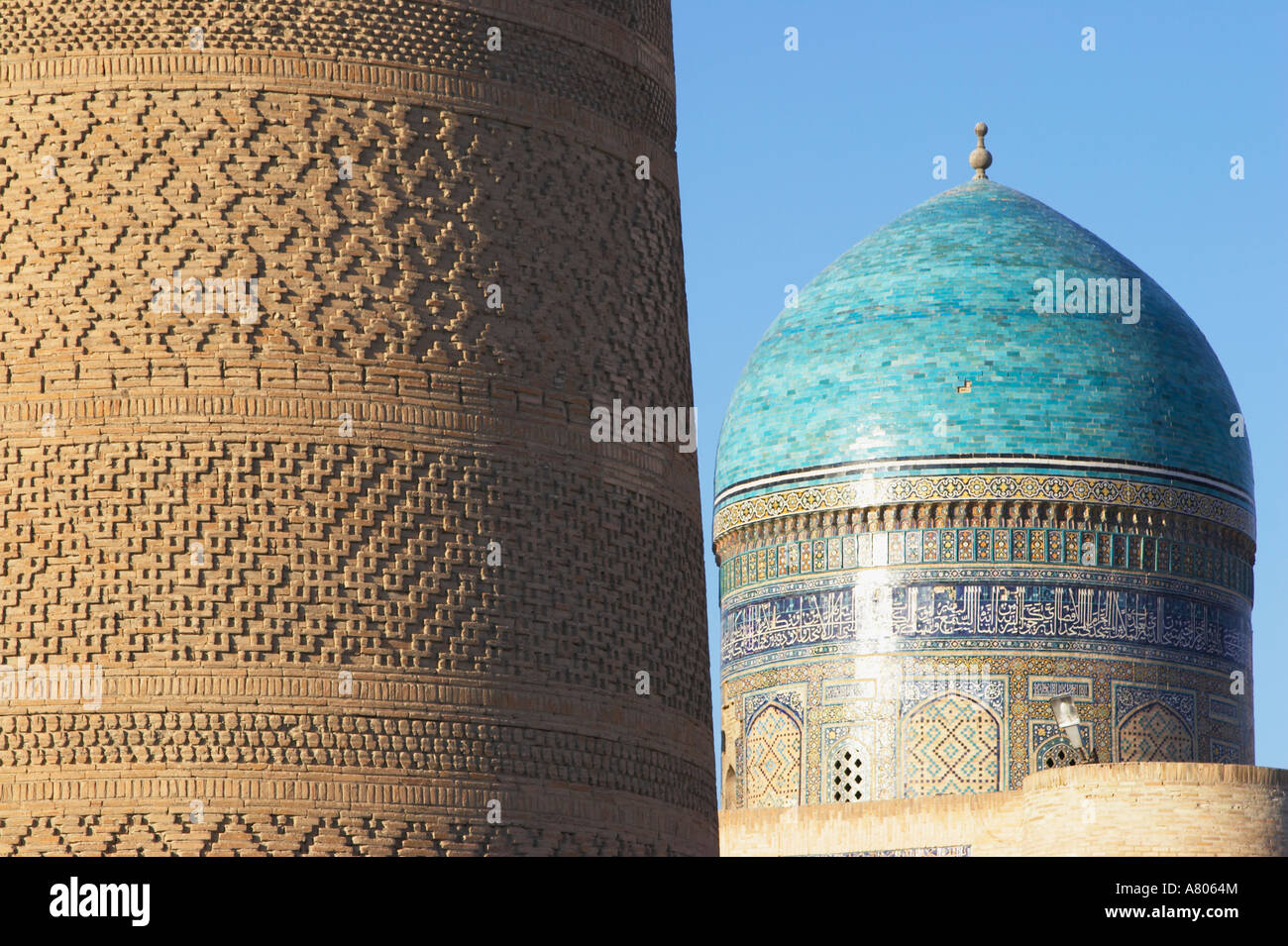 Uzbekistan, Bukhara, Kalon Minaret And Dome Of Mir-i-Arab Medressa Stock Photo