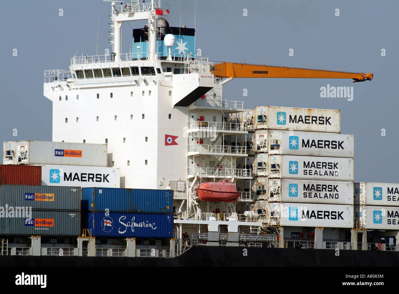 stacked container boxes for importing and exporting on the container ship carrier MAERSK Nottingham on Southampton Water England Stock Photo