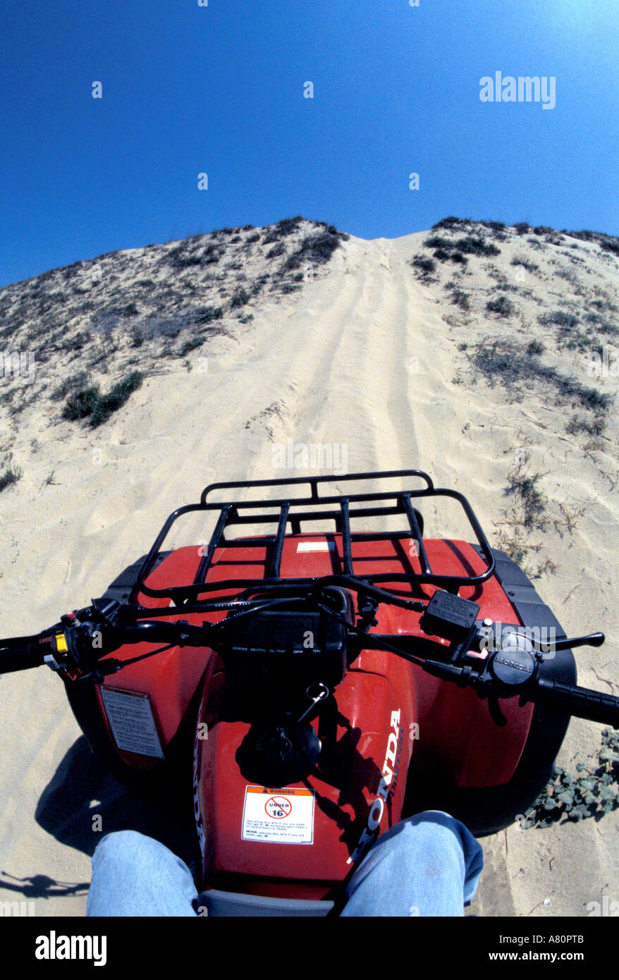 Dune buggy in desert climbing hill ATV all terrain vehicle off road 4