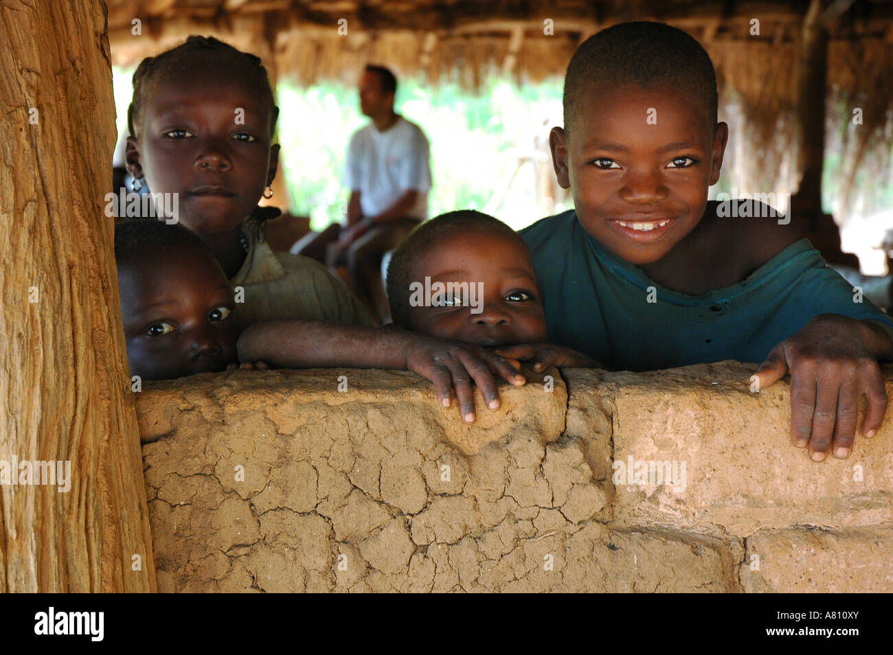 African children africa hut smiling hi-res stock photography and images ...