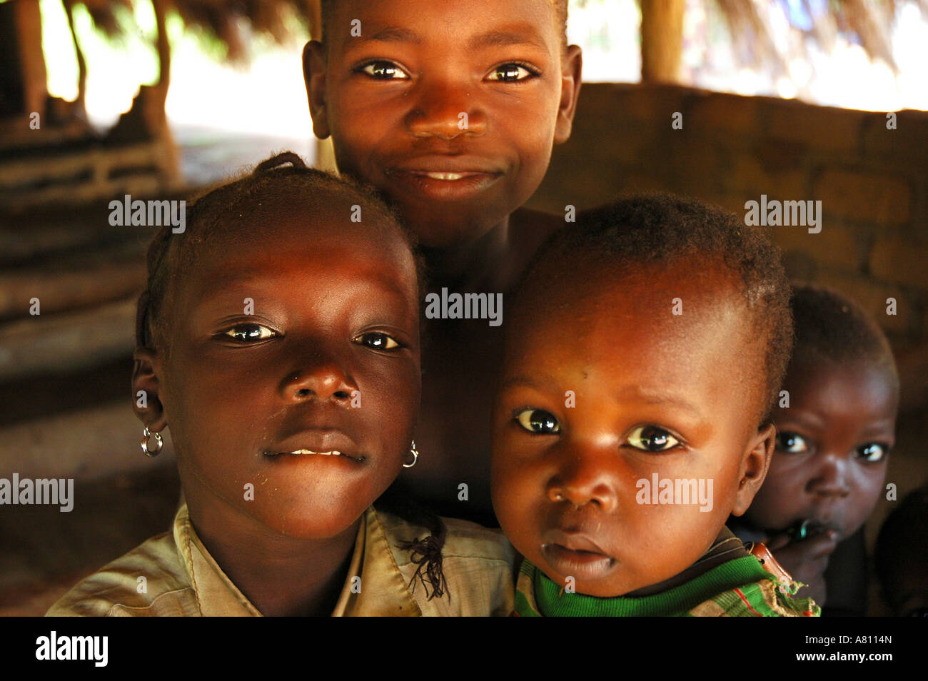 African children africa hut smiling hi-res stock photography and images ...