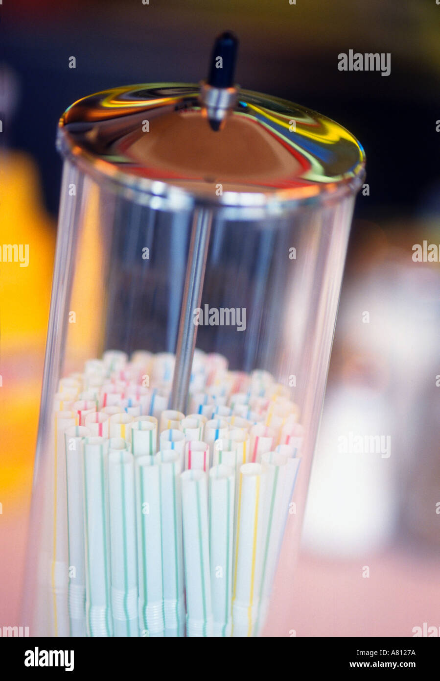 https://c8.alamy.com/comp/A8127A/straw-dispenser-on-counter-of-american-style-diner-A8127A.jpg