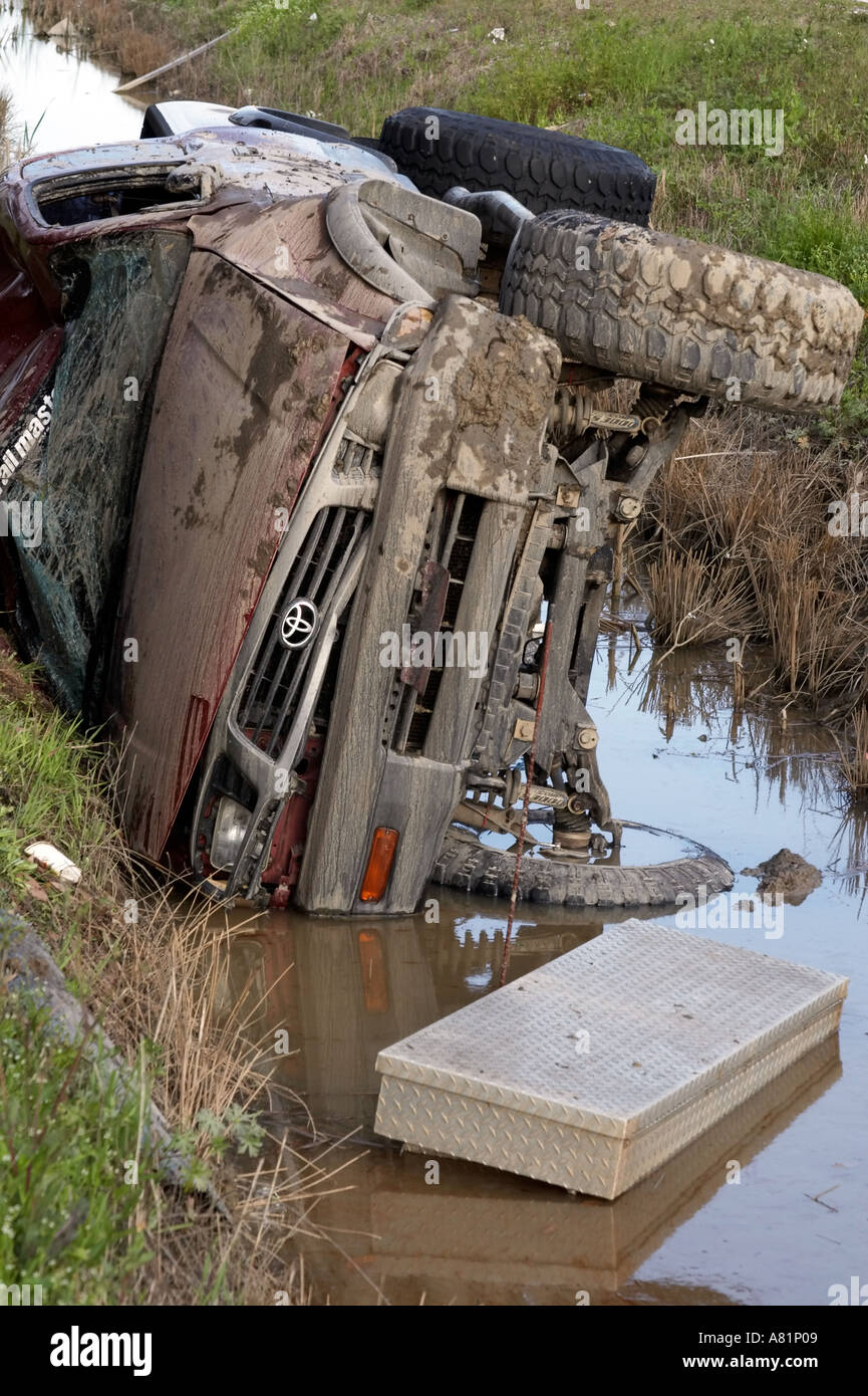 An pickup truck on its side in the ditch after an accident Stock Photo ...