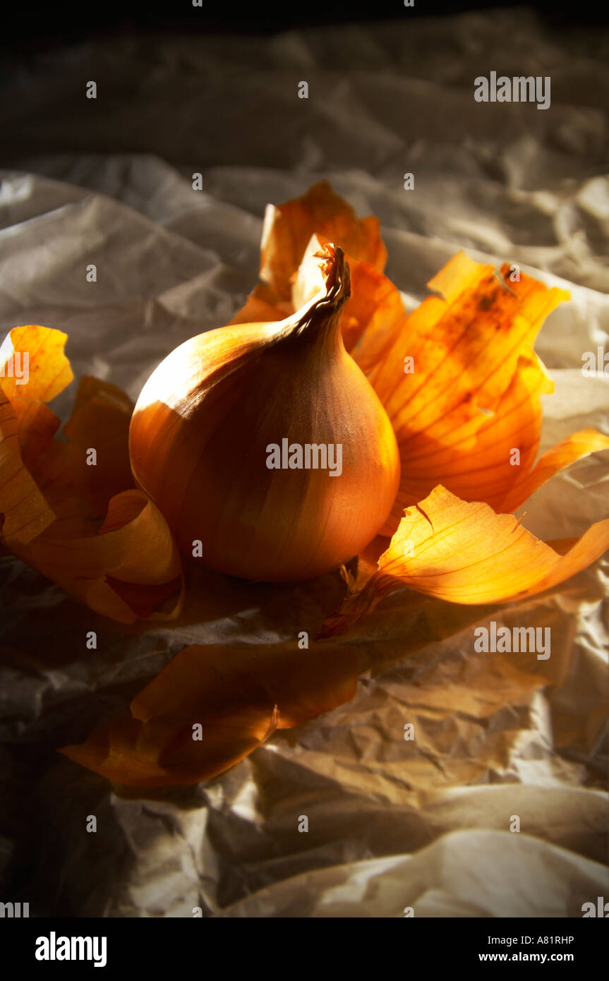 unwrapped onion on tissue paper Stock Photo Alamy
