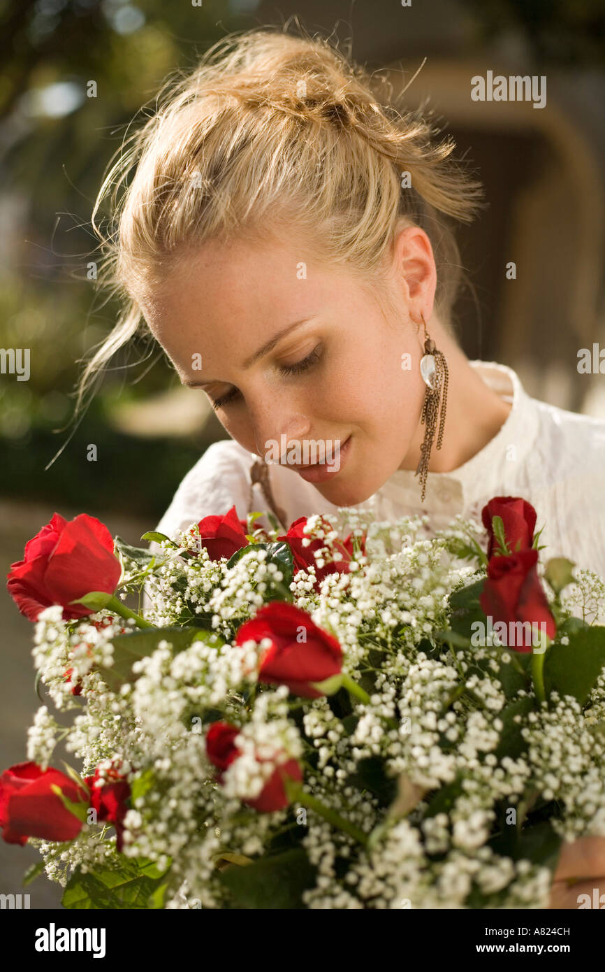 A young woman with a flower arrangement Stock Photo - Alamy