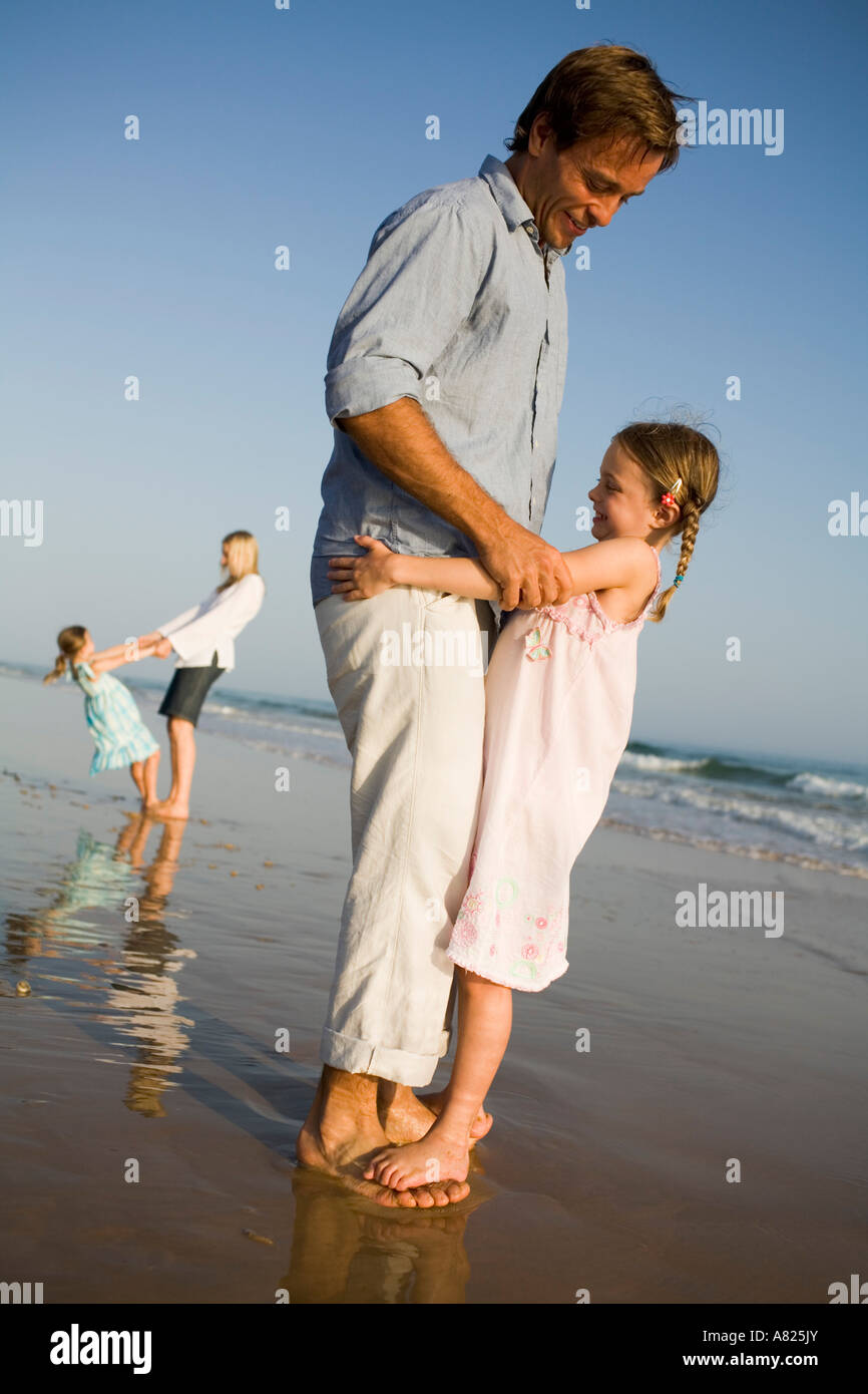 A family playing at the beach Stock Photo - Alamy