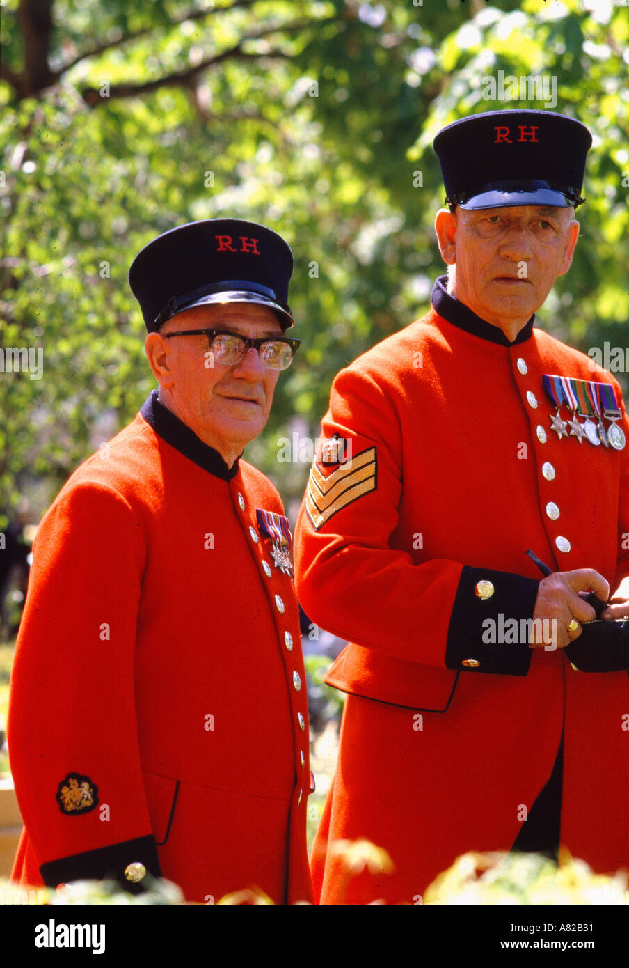 Two Chelsea Pensioners at the annual Chelsea Flower Show in the grounds of Royal Hospital Chelsea London England Stock Photo