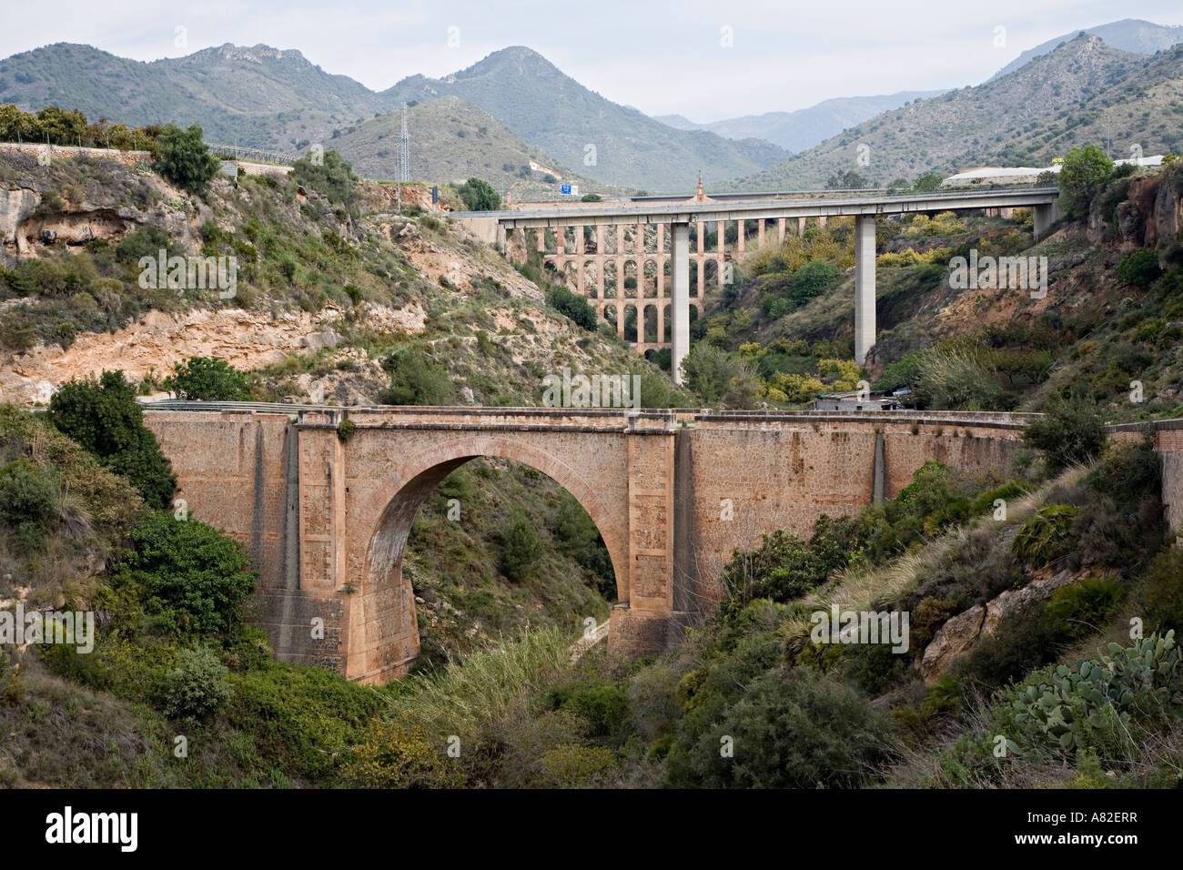 New and old road bridges with aqueduct Barranco de Maro ravine Nerja Spain Stock Photo