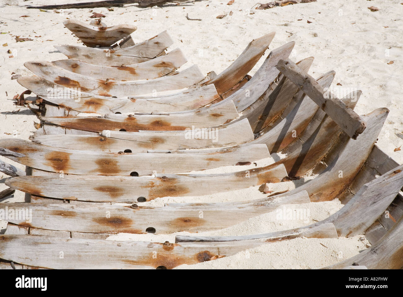 Wrecked wooden long tail boat thailand buried keel, hull curvatures on Koh Mai Phai is also called Bamboo Island Krabi Province Andaman Sea Thailand Stock Photo
