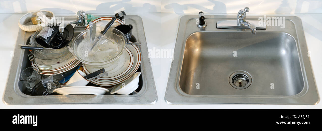 Dirty and clean kitchen sinks next to each other Stock Photo