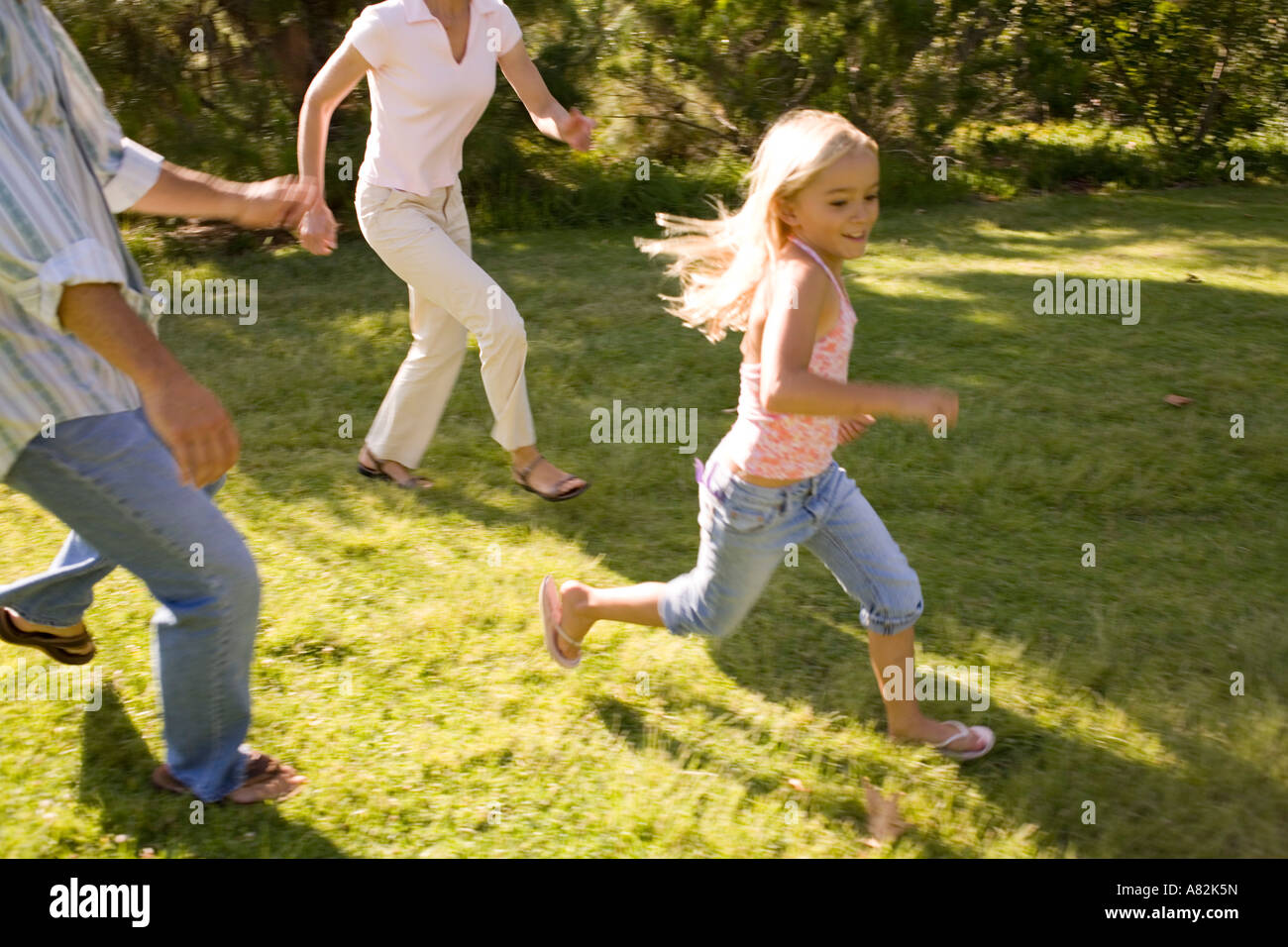 A family in a park playing Stock Photo