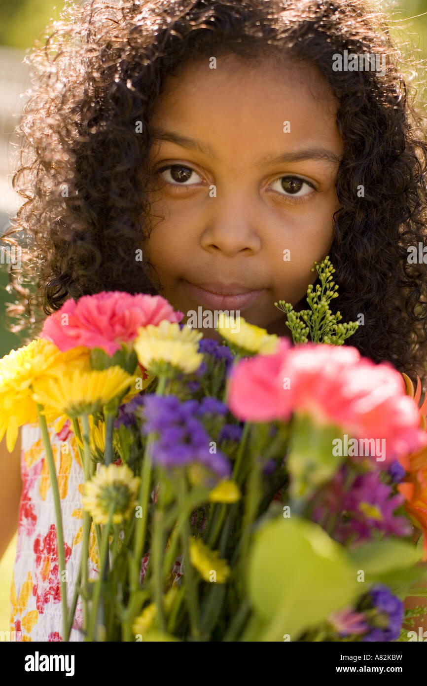 A girl in a park with a bouquet of flowers Stock Photo - Alamy