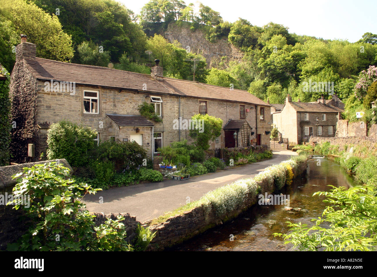 Houses by the river in Castleton Derbyshire Stock Photo Alamy