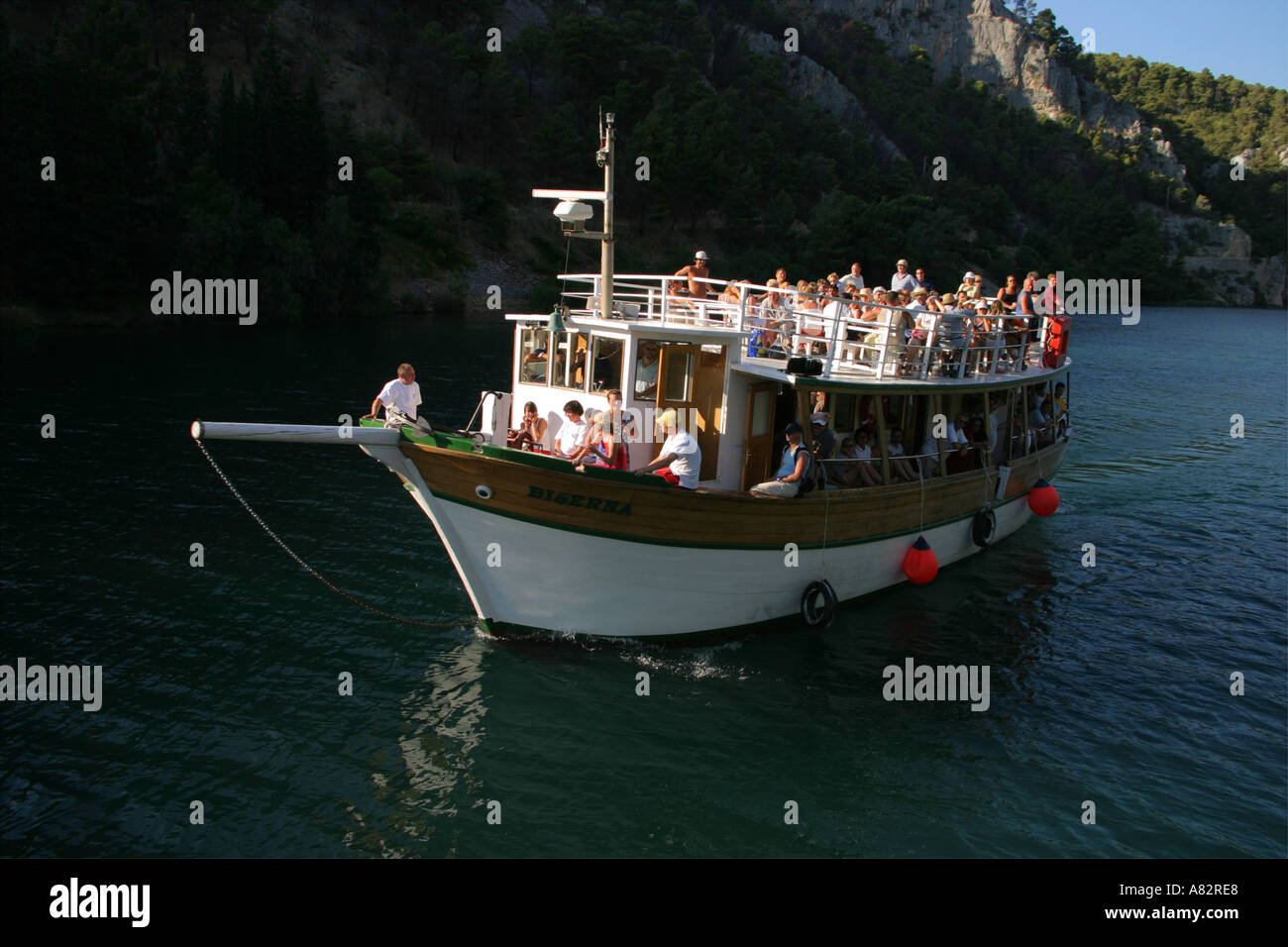 Skradinski buk waterfalls Croatia, wooden boat with tourists Stock Photo