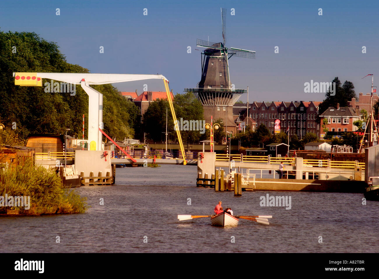 Amsterdam draw bridge and windmill Stock Photo