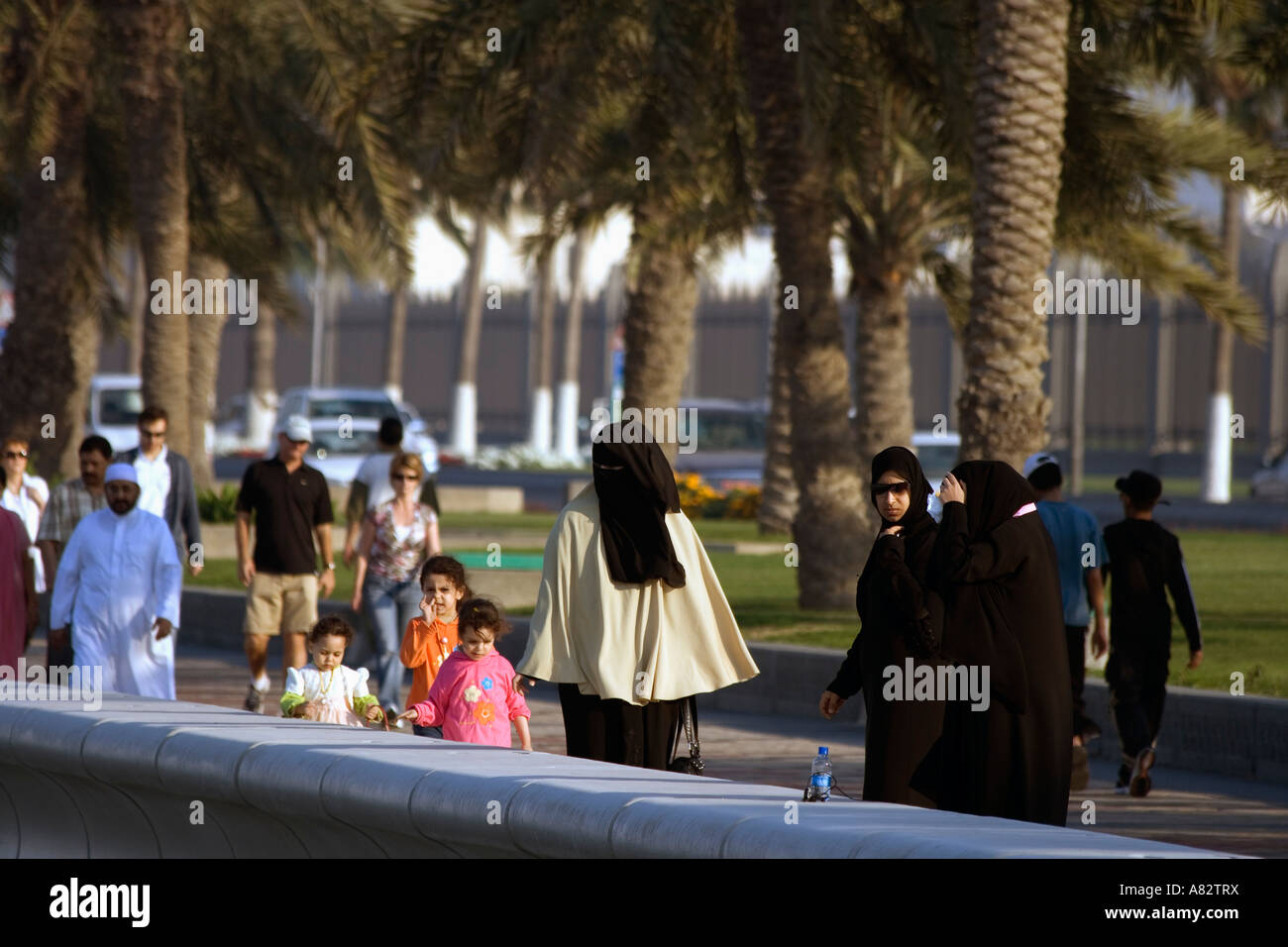 Qatar Doha corniche promenade people veiled women Stock Photo