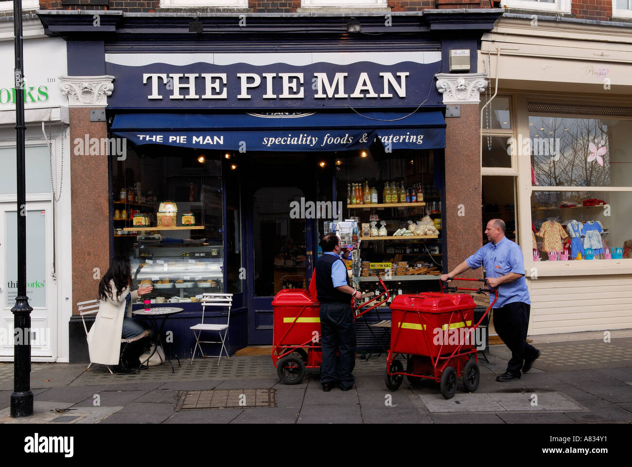 Two postman doing their morning delivery. London England The Pie Man