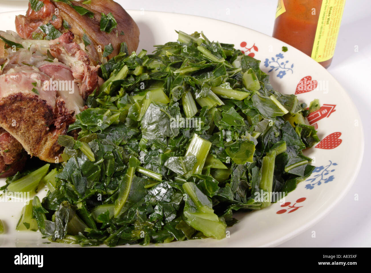 Ham hock with collard, turnip and mustard greens Stock Photo Alamy