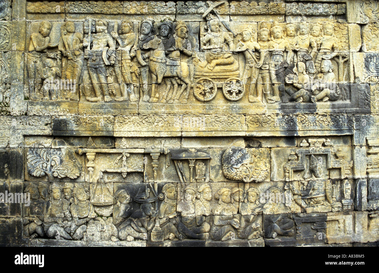 Bas relief carvings on the walls of Borobudur Buddhist temple site in Java Indonesia Stock Photo