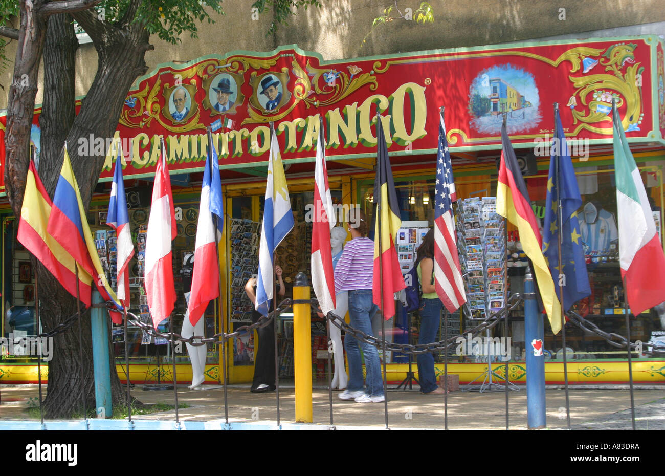world flags outside a Typical Colourful Tango sign for a tourist shop in Caminito, La Boca, Buenos Aires Stock Photo