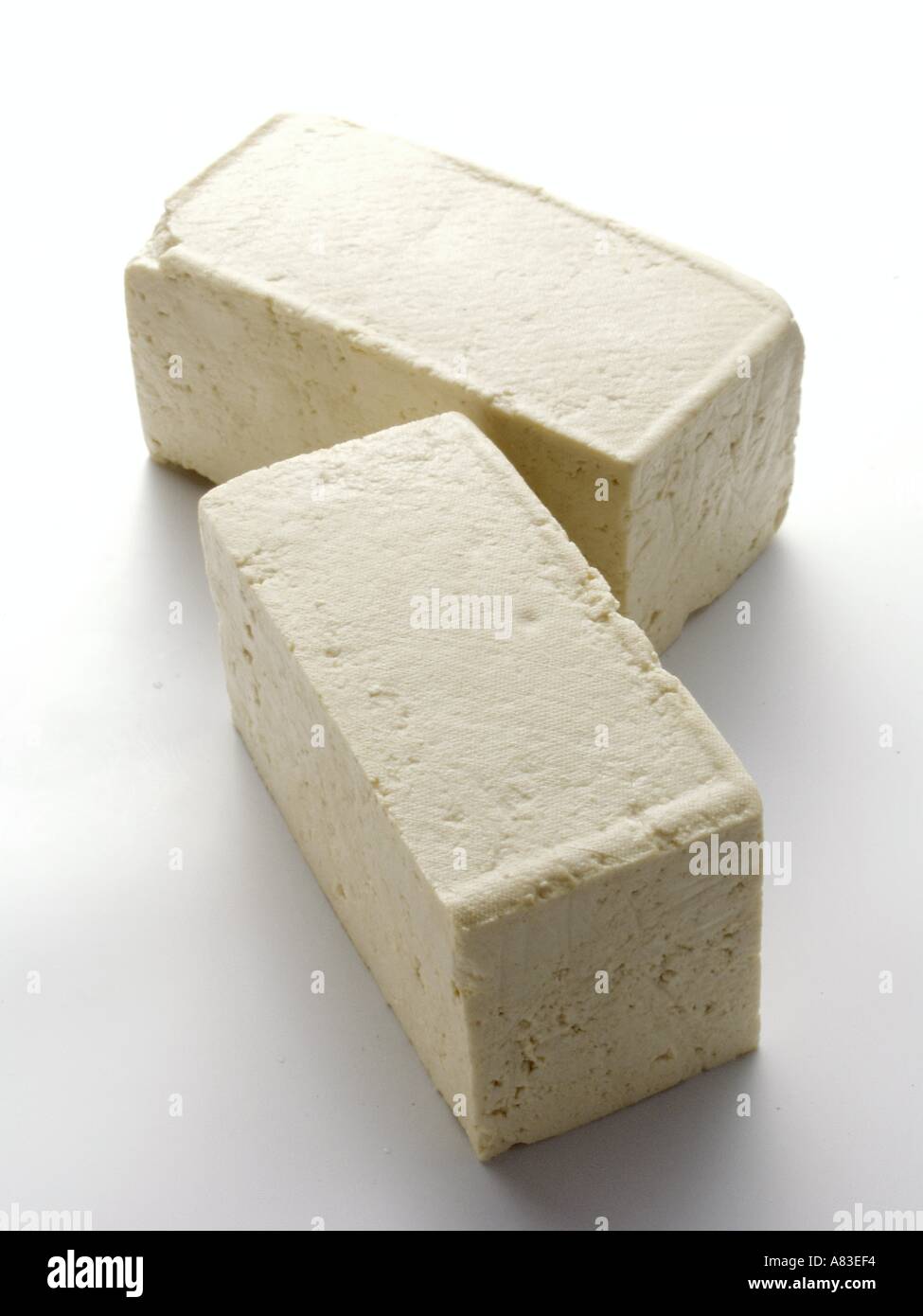 Firm Tofu on a Chopping Board with shape cutter Stock Photo - Alamy