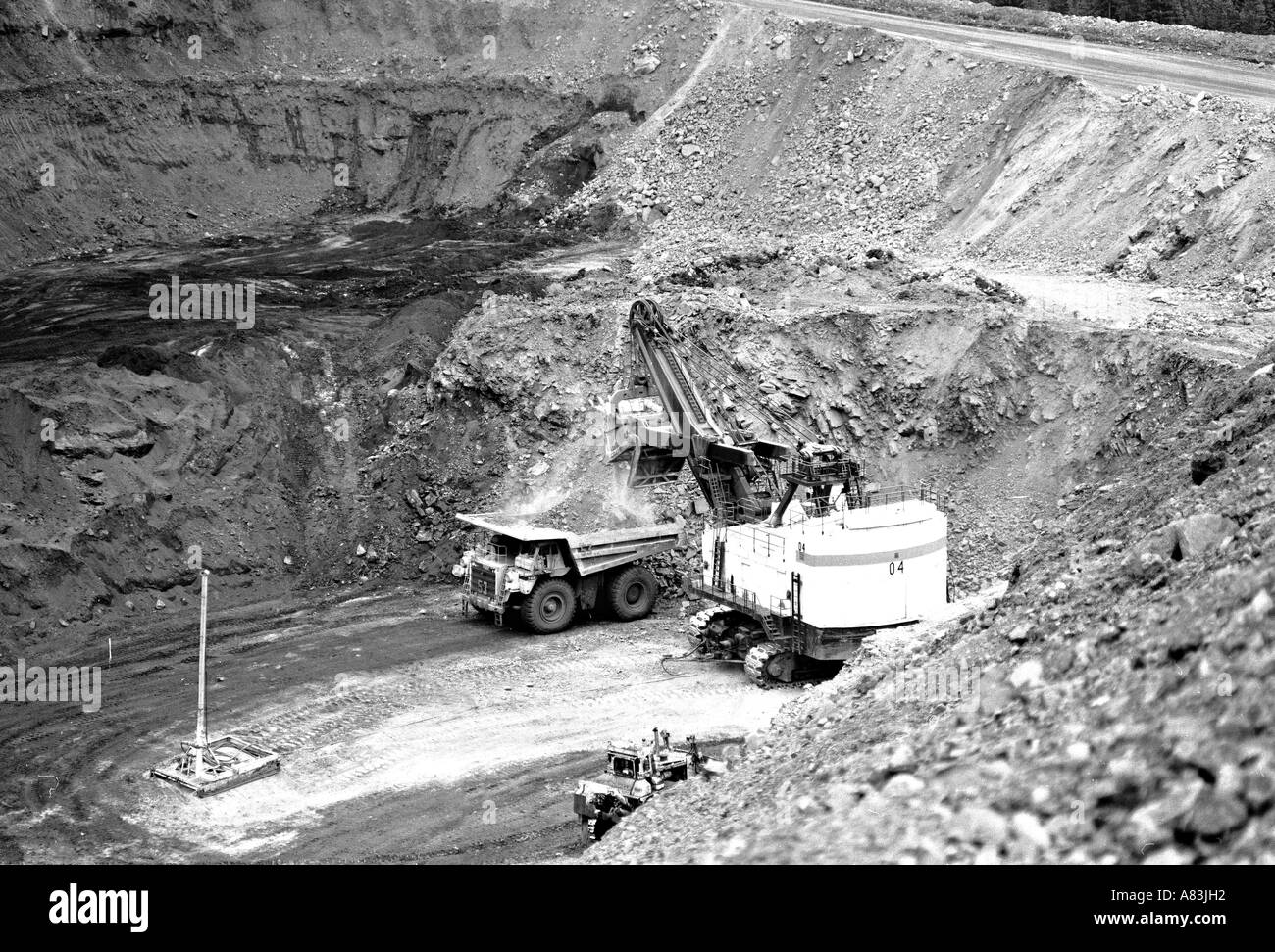 Equipment working in an open pit Coal Mine Stock Photo
