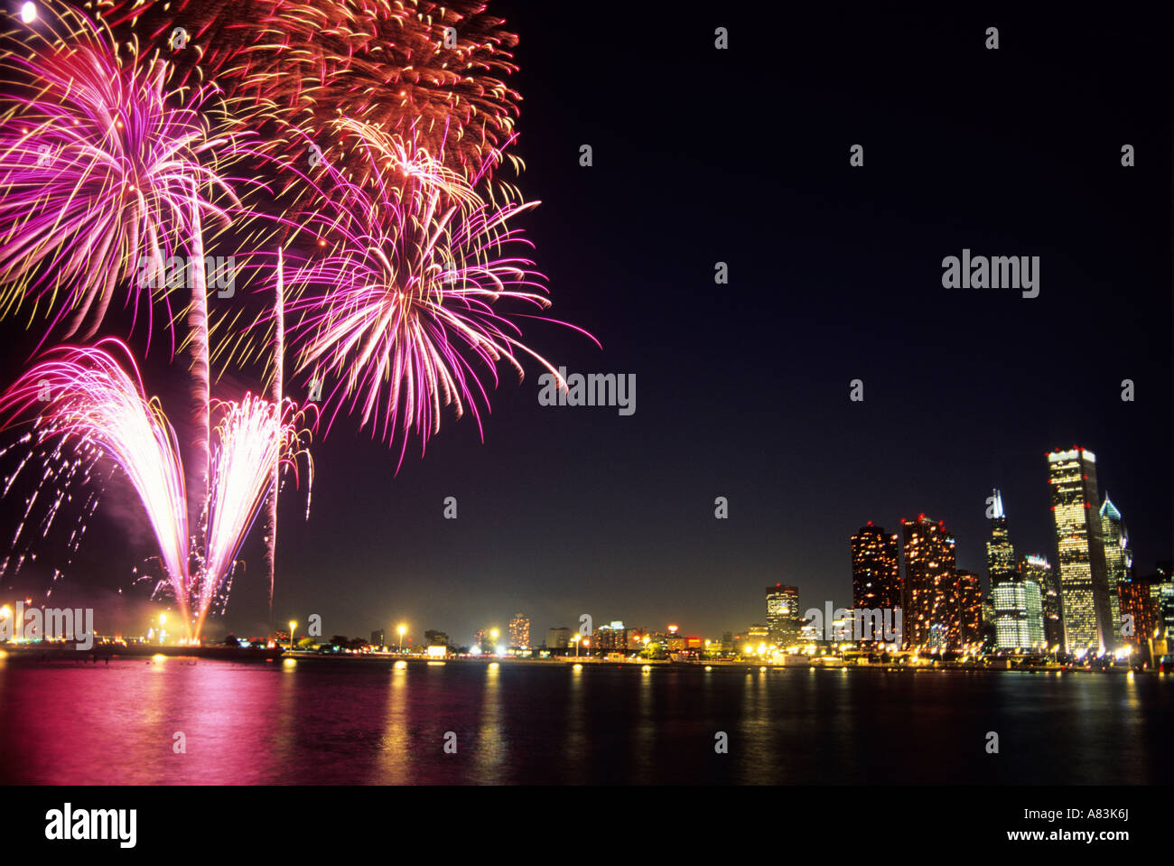A fireworks display and the Chicago skyline at night in Illinois Stock
