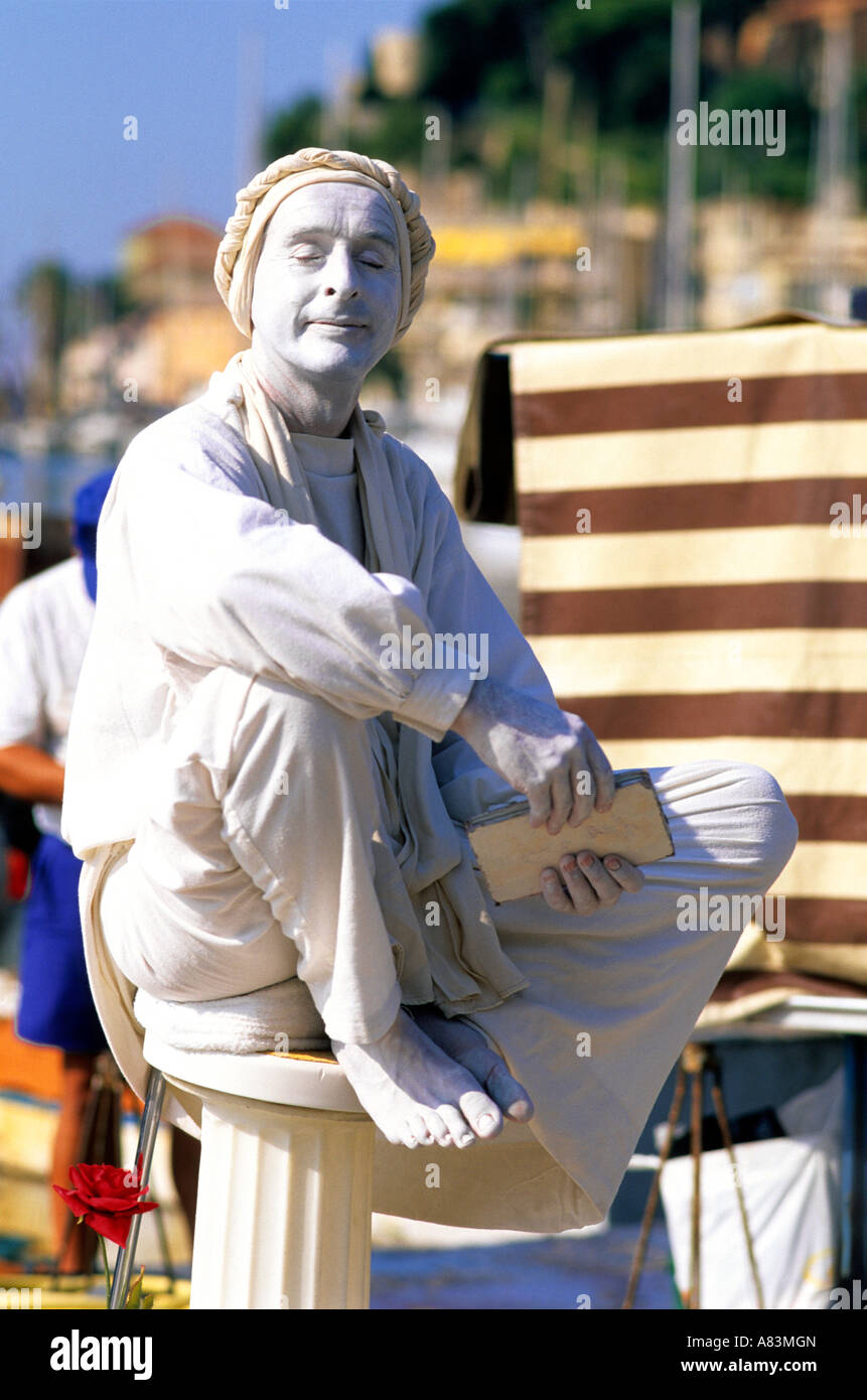 A mime painted and wearing all white in France Stock Photo