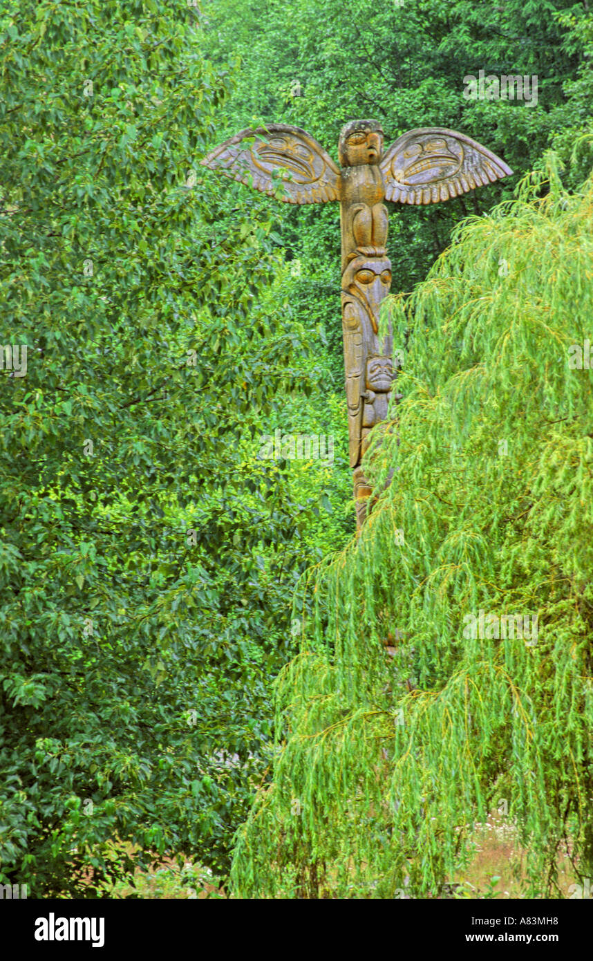 Bird totem in the trees Stock Photo