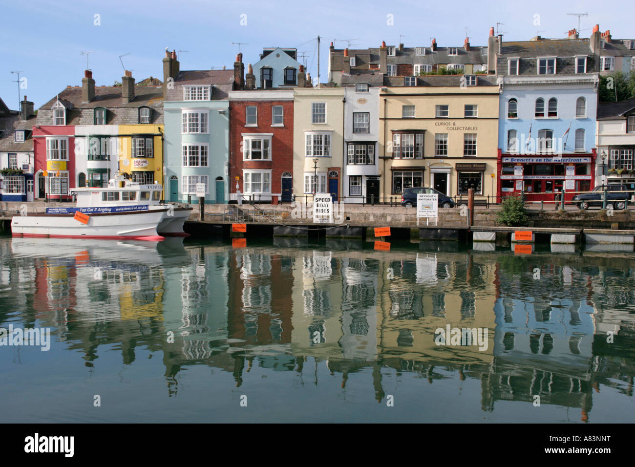 weymouth harbour coloured houses reflecting in harbour dorset england