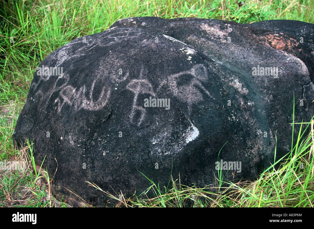 Rock art on boulder Stock Photo