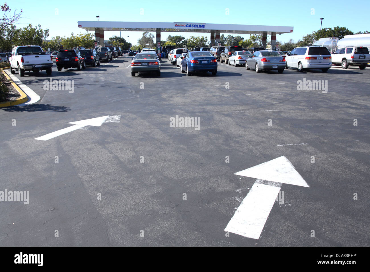 cars waiting in line for getting cheap fuel at costco gas pump 951 palomar airport rd, carlsbad, california, usa Stock Photo