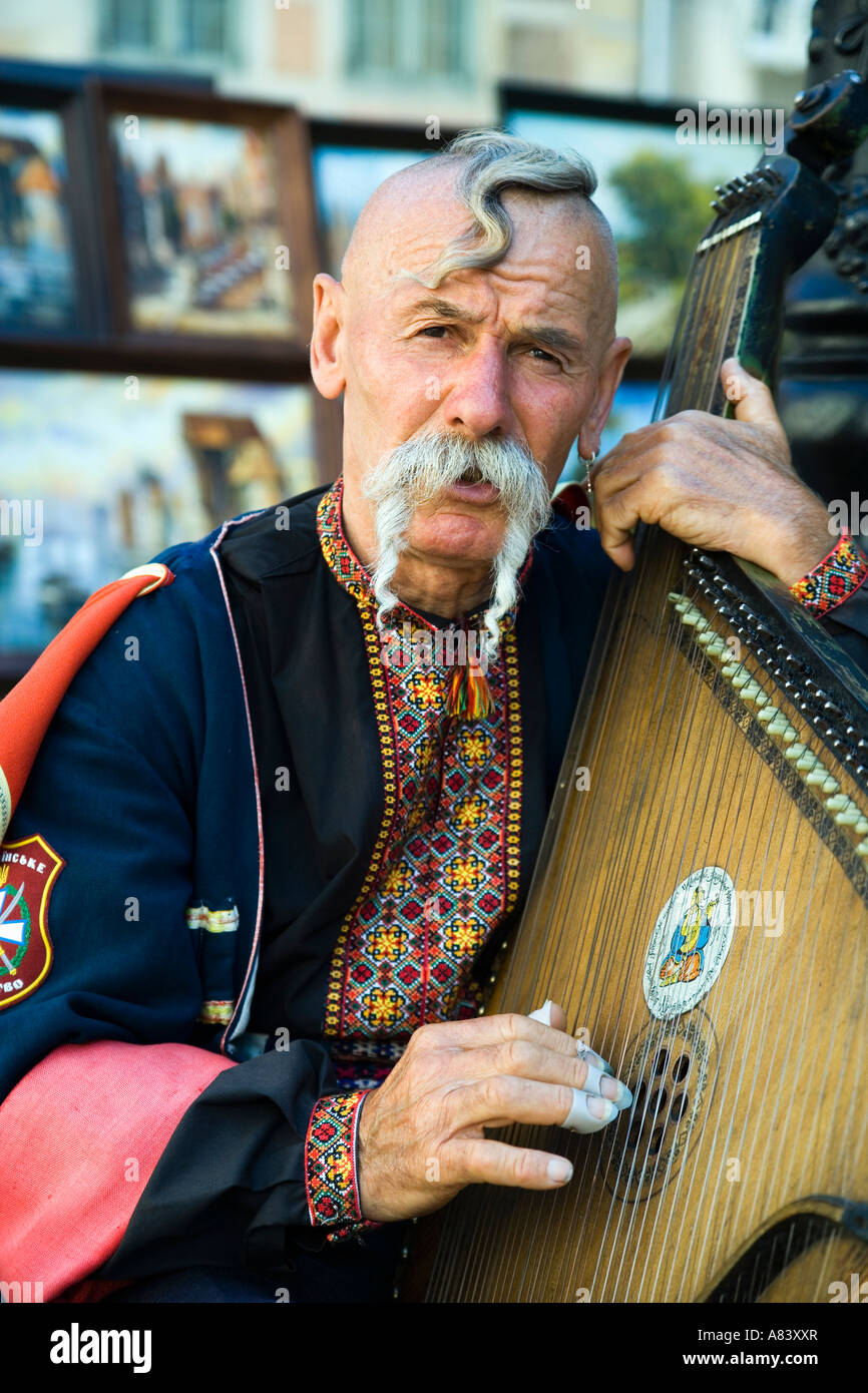 Gdansk, Poland; Cossak singer with zither in Dlugi Targ (Long Market) Stock Photo