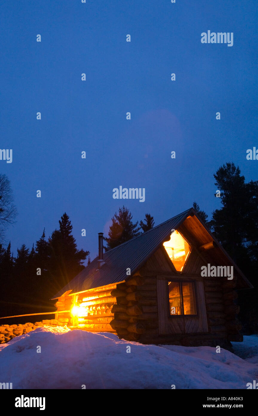 A log cabin in the winter night Snowshoe Country Lodge Isabella ...