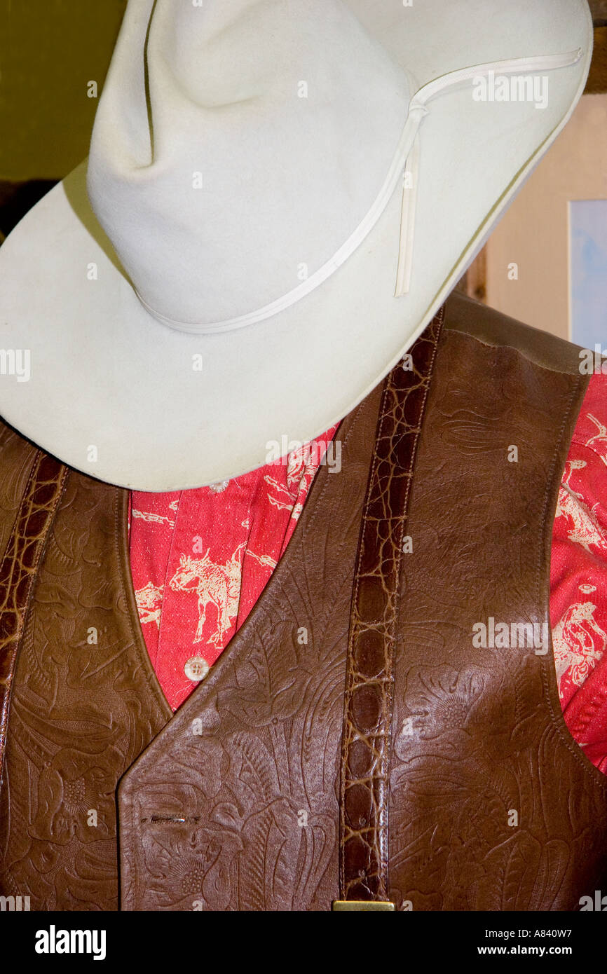 Antique Store Display of Western Cowboy Hat, Shirt, and Leather Vest