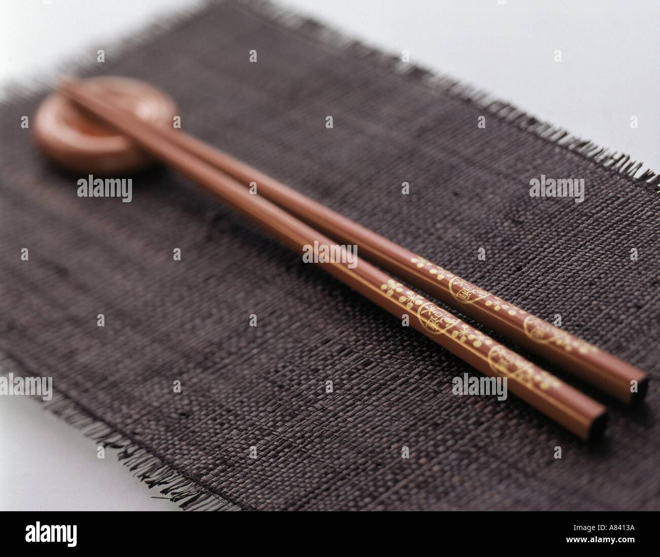 Red Chopsticks with Holder on Black Placemat Stock Photo Alamy