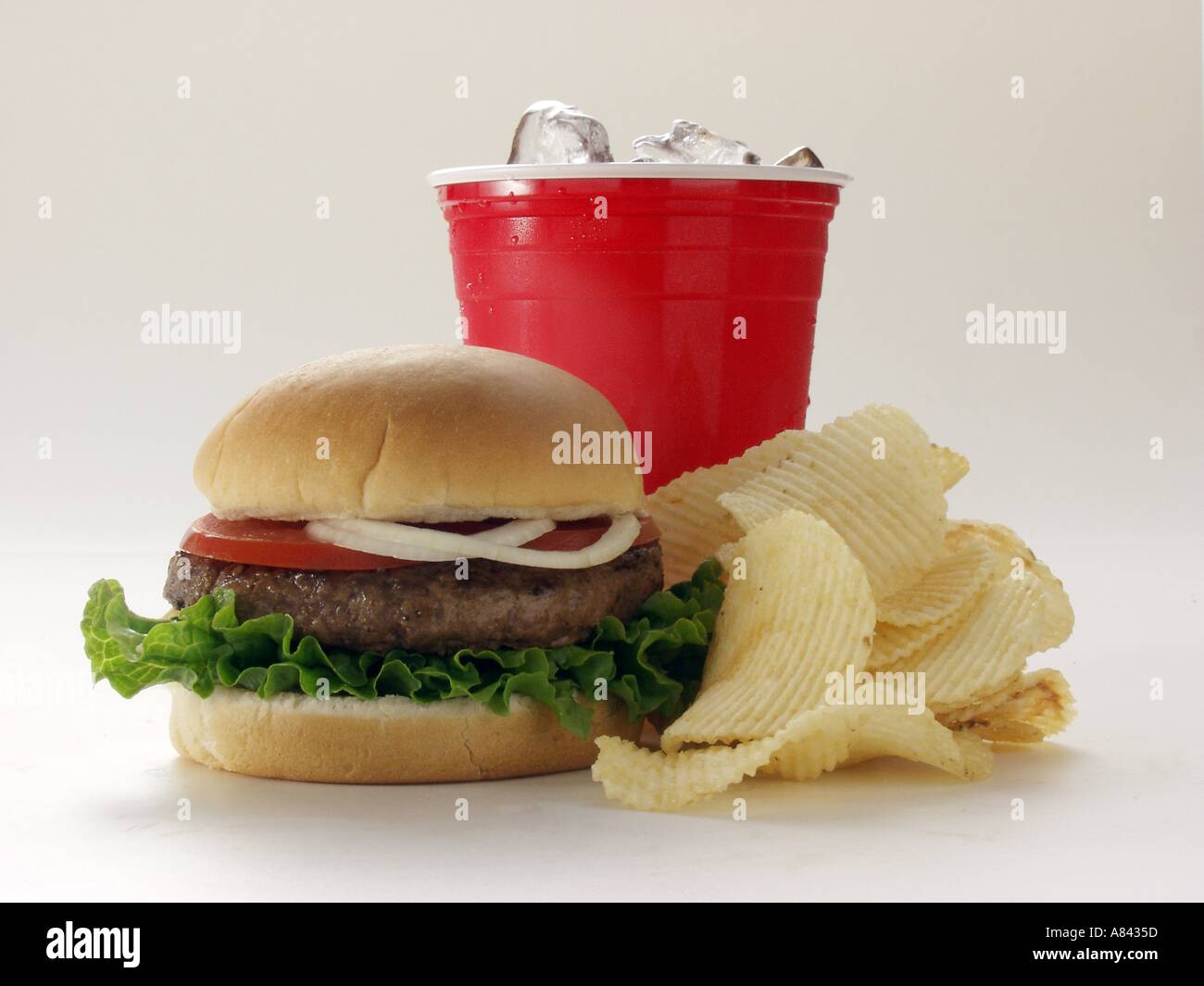 A Hamburger with Potato Chips and Soda Stock Photo Alamy