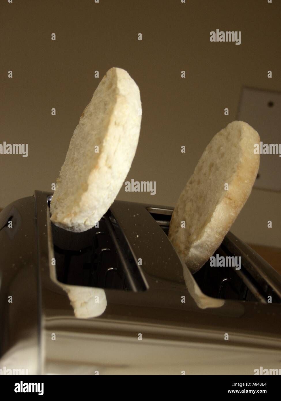 An English Muffin Popping from a Toaster Stock Photo Alamy
