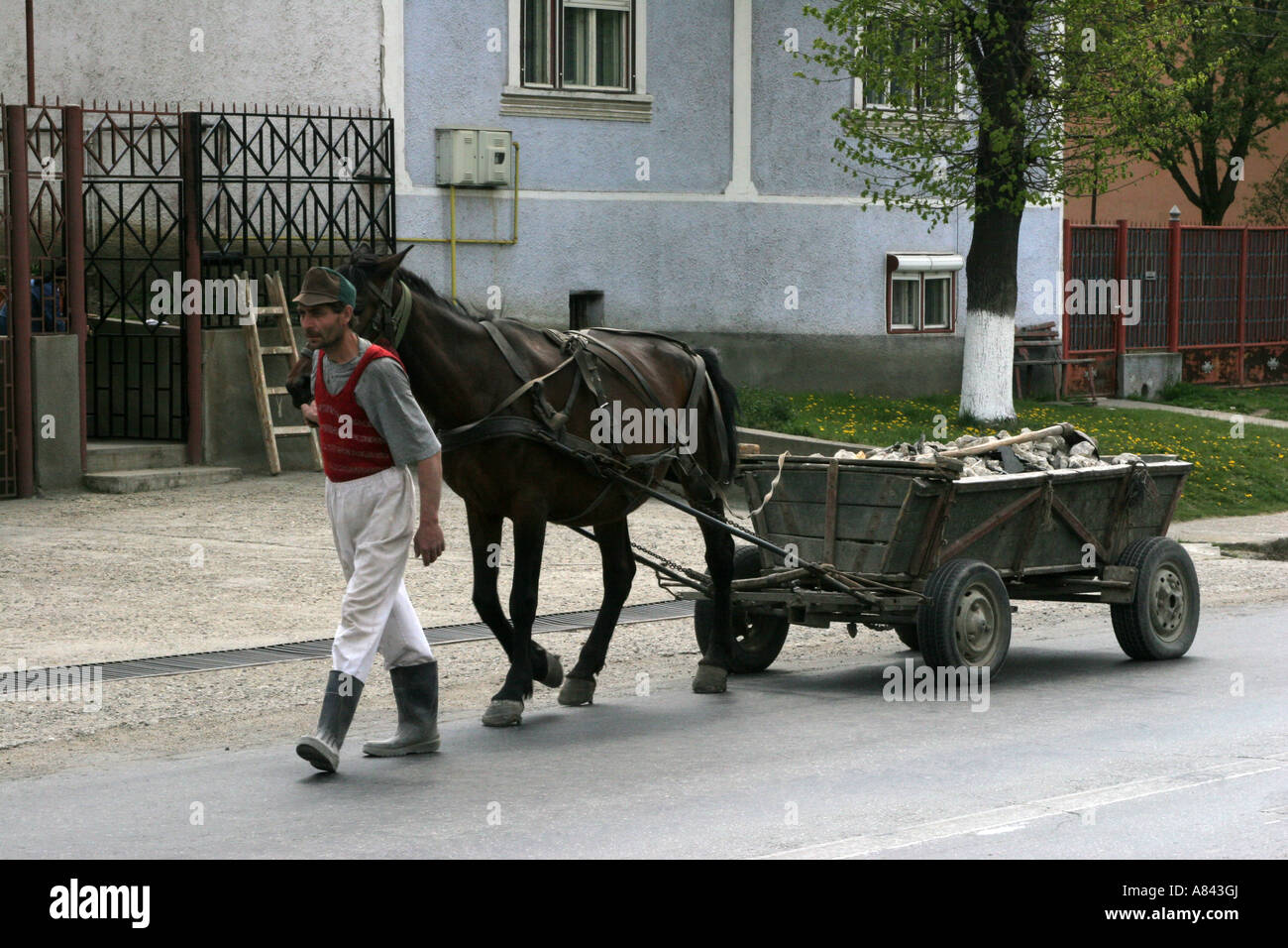 Man with horse drawn wagon Copsa Mica is the most polluted town in Europe April 2007 Romania Stock Photo