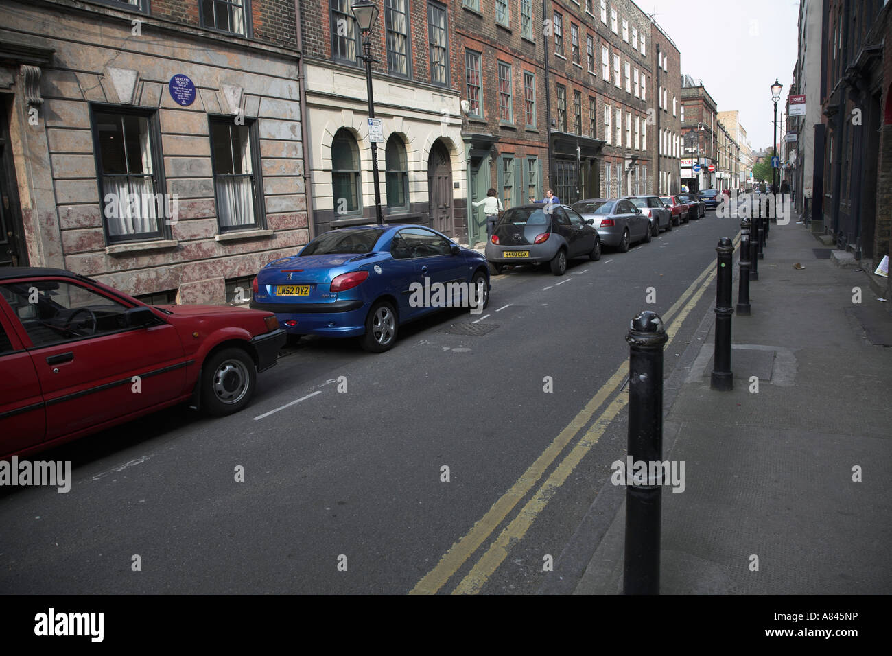 Expenisive cars parked on Princelet Street London East End, E1, England - gentrification Stock Photo