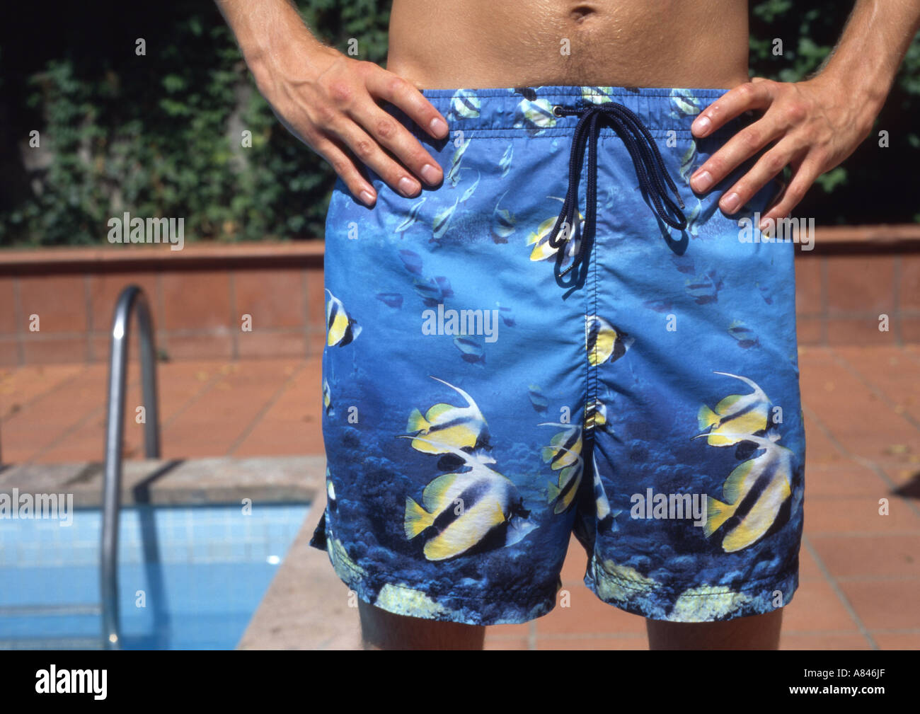 man with fish covered bathing costume and swimming pool Stock Photo - Alamy