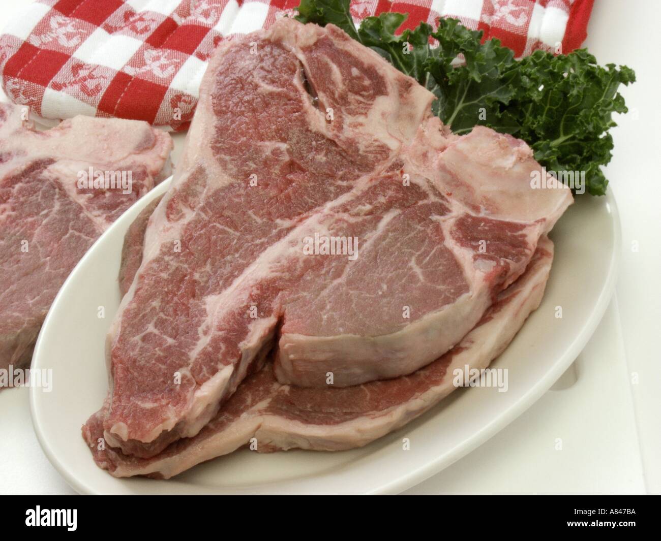 Two T Bone Steaks on a Platter Stock Photo Alamy
